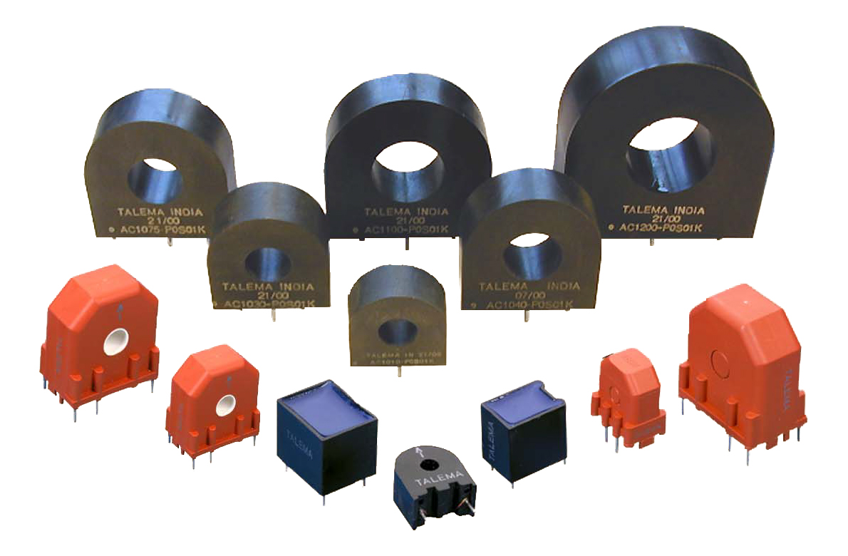 Picture of several current transformers placed on a white background.