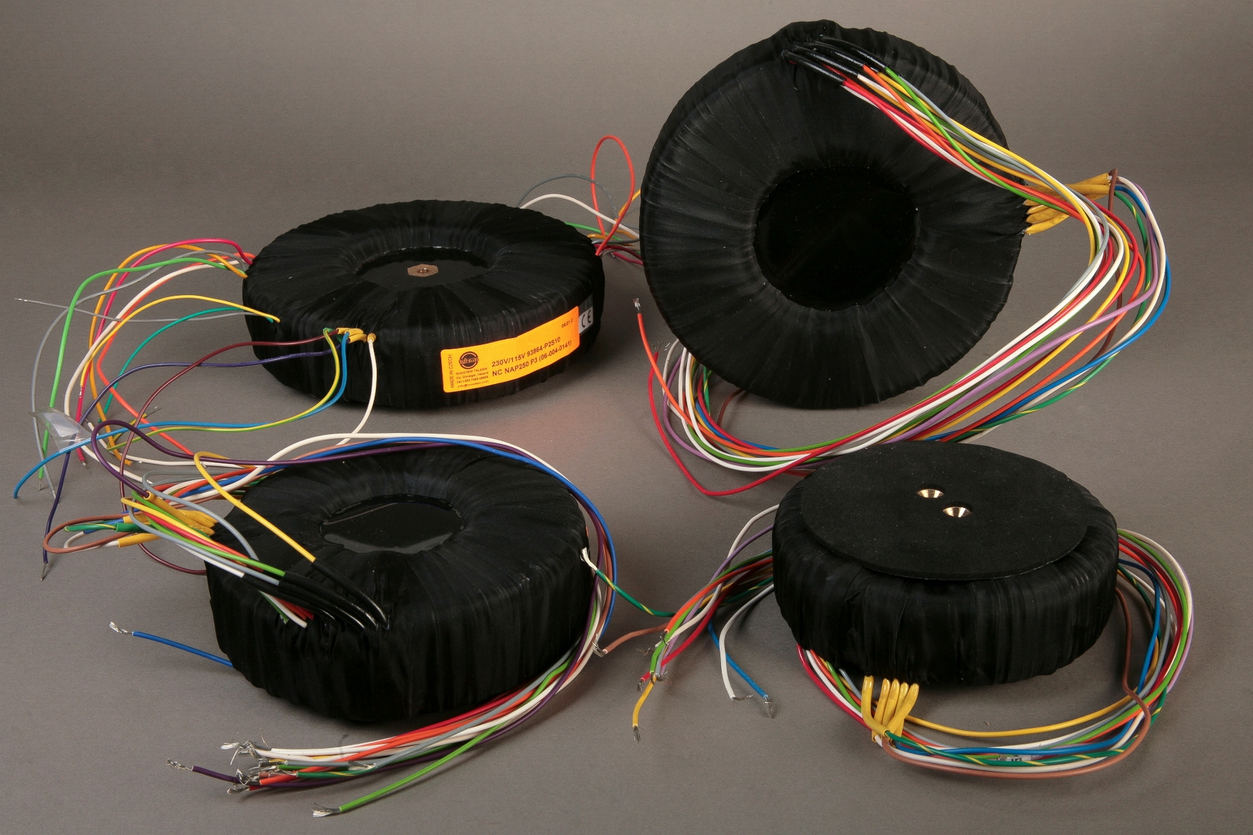A picture of four audio transformers.